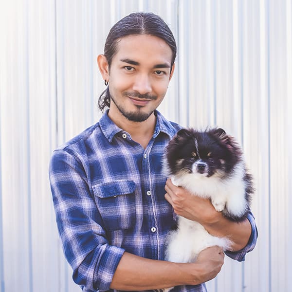 Gentleman Holding Small Older Dog